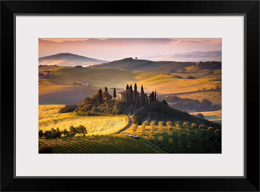 Podere Belvedere, San Quirico d'Orcia, Tuscany, Italy. Sunrise over the farmhouse and the hills.