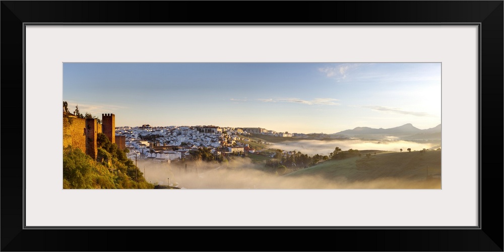 Goldern morning light illuminates  defensive walls in old town Ronda, Ronda, Malaga Province, Andalusia, Spain