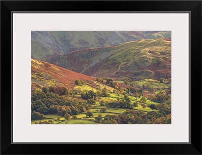 Rural farmland below Cumbrian mountains, Martindale, Lake District, Cumbria, England.