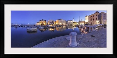 Slovenia, Istria, Piran. The picturesque port and the buildings around it at dusk