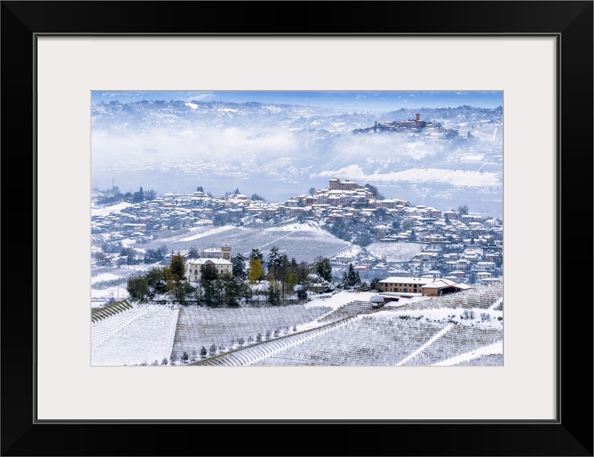 Snow on the three hills of Ceretto Wine, Roddi and Santa Vittoria d'Alba from Diano d'Alba, Piedmont, Italy