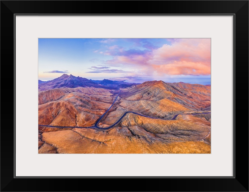 Spain, Canary Islands, Fuerteventura, mountain road crossing the volcanic landscape near Sicasumbre astronomical viewpoint