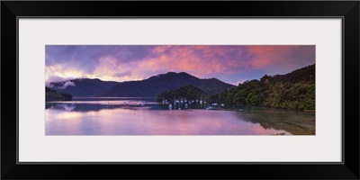 Sunset illuminates the picturesque Ngakuta Bay, Queen Charlotte Sound, New Zealand