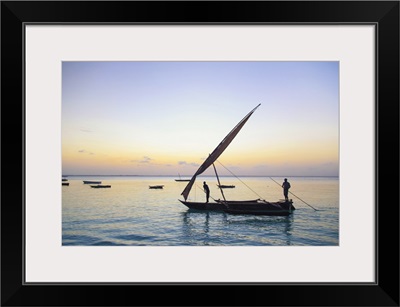 Tanzania. Zanzibar, Michamvi Village, Dhows (traditional sailboats) sailing at sunset