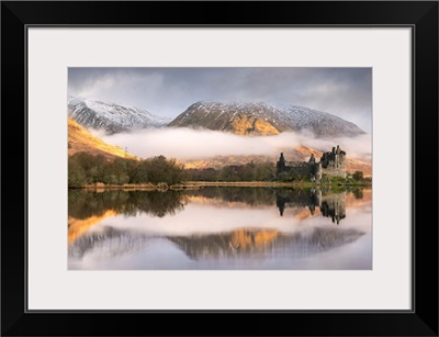The abandoned ruin of Kilchurn Castle on a misty winter morning, Loch Awe, Scotland