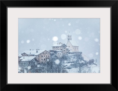 Village Of Colle Santa Lucia, Church On The Hill Under A Snowfall, Agordino, Italy