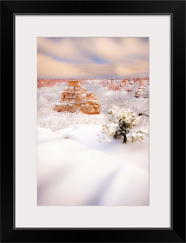 A winter moon rises as storm clouds break up at sunset, Colorado