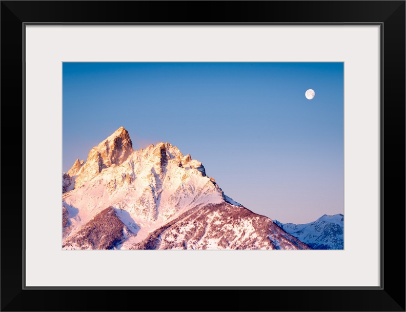 The Moon Sets As Sun Rises Over Grand Teton's Peak; Grand Teton National Park, Wyoming