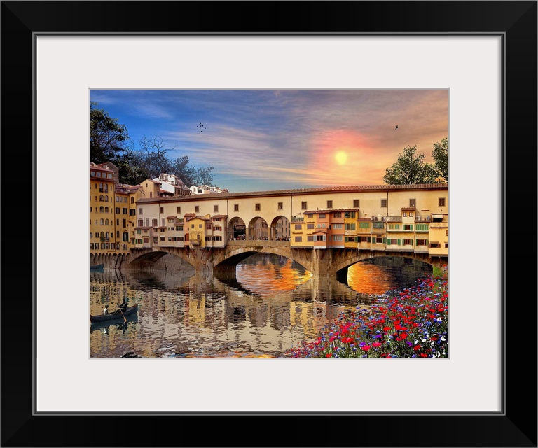 A landscape picture of a bridge in Italy that is reflected in the water below with a canoe rowing toward it and the sun se...