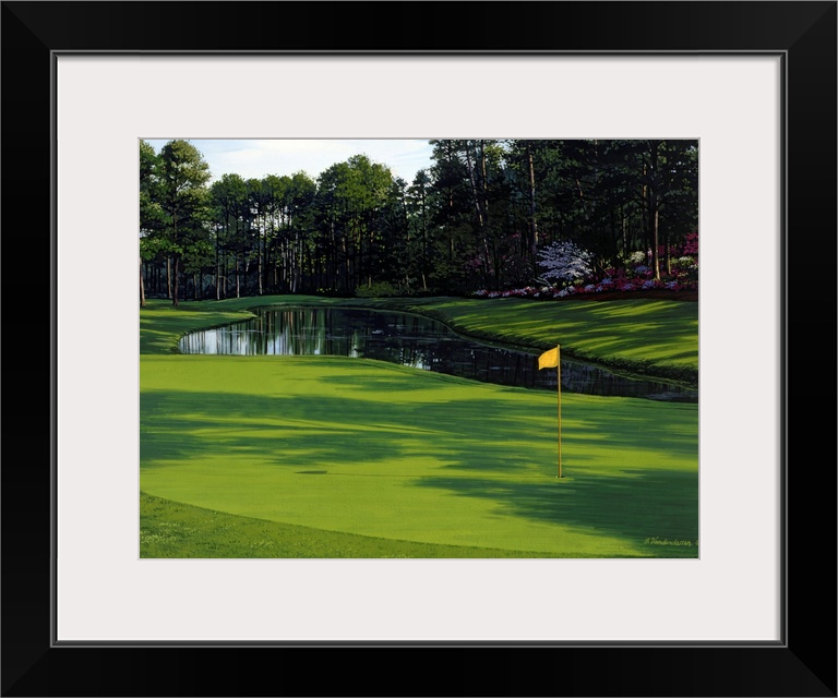 Photograph of the greenway on a golf course with a small pond and trees just behind it.