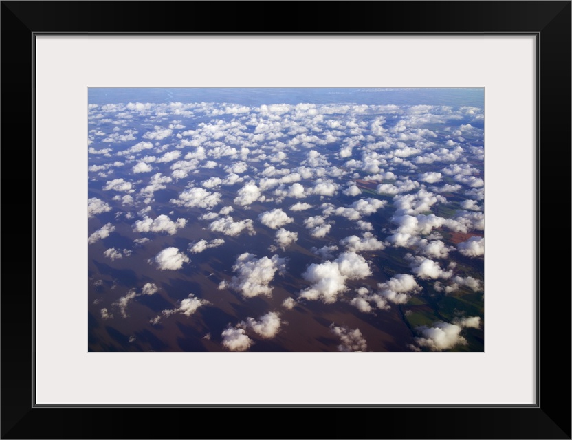 Scattered clouds, aerial over Rio de la Plata, Argentina.