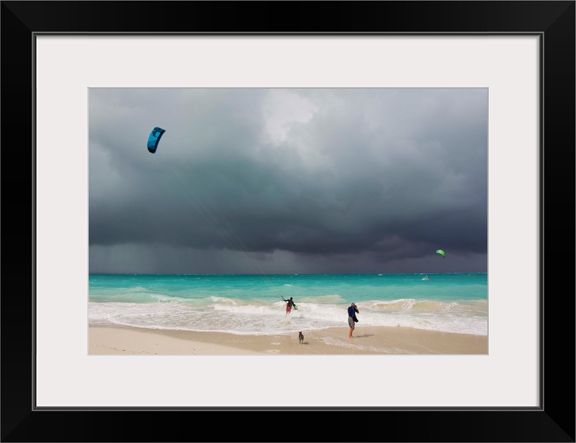 A kiteboarder enjoying gusty winds created by Hurricane Tomas.