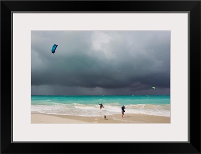 A kiteboarder enjoying gusty winds created by Hurricane Tomas