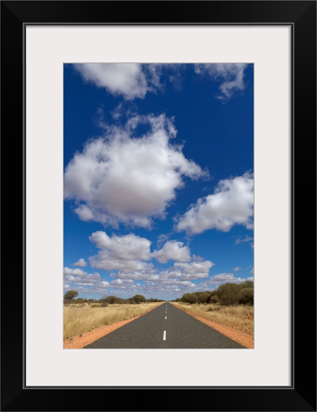 Cumulus Clouds and Desert Road in Northern Territory Australia