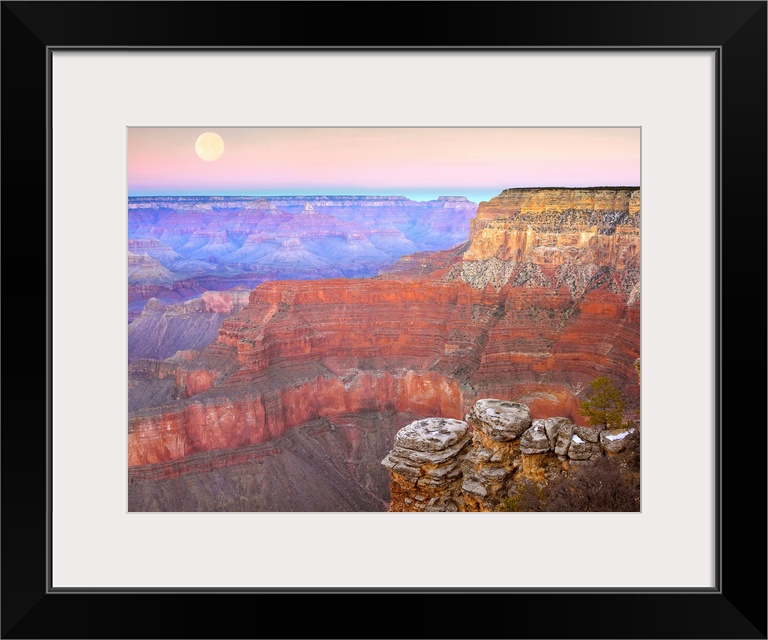Amazing landscape photograph of the famous Southwest American canyon the captures a wide variety of colors and a full moon...