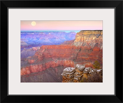 Full moon over the Grand Canyon at sunset as seen from Pima Point Arizona