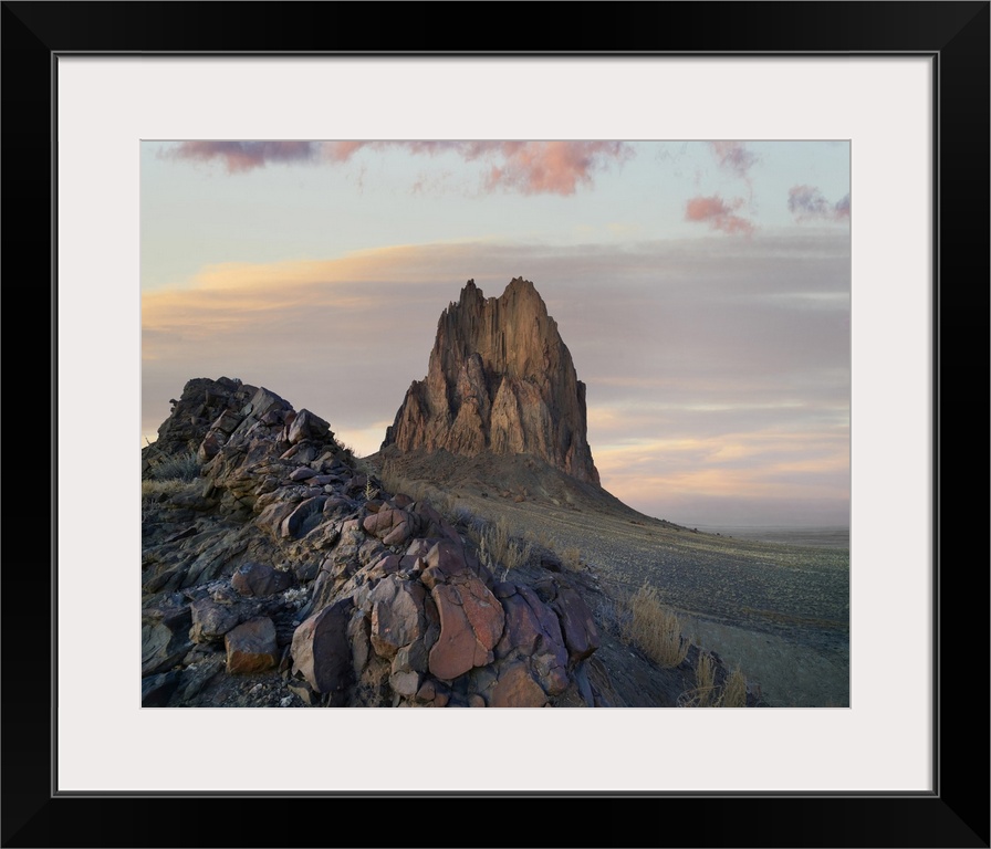 Ship Rock at sunset, remnant basalt core of extinct volcano, New Mexico