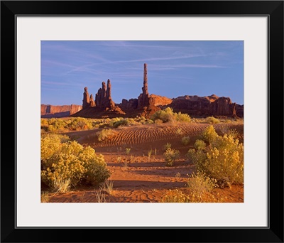 Totem Pole and Yei Bi Chei with sand dunes and shrubs, Monument Valley, Arizona