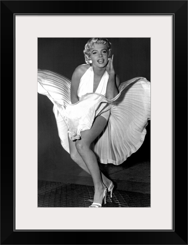 A vertical photograph of the actress in her white dress and high heels standing over a subway grate causing her skirt to b...