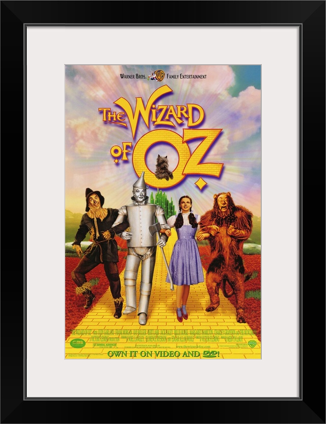 Wall art of a classic movie with the Scarecrow, Tin man, Dorothy and the Cowardly Lion walking down the yellow brick road.