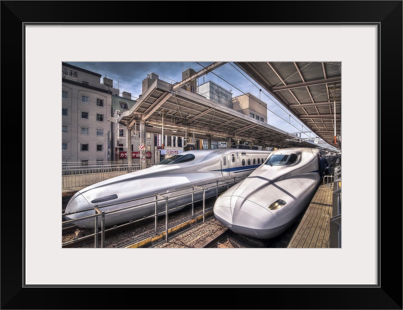 HDR photograph of two bullet trains stopped at a station in Japan.