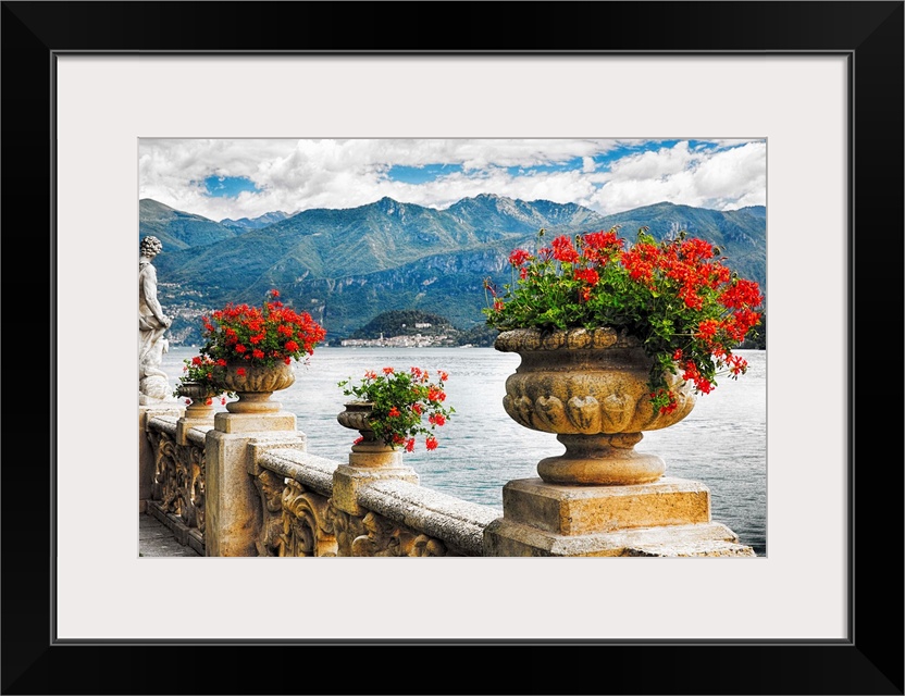 Fine art photo of a stone wall with urns full of blooming flowers, Lake Como, Italy.