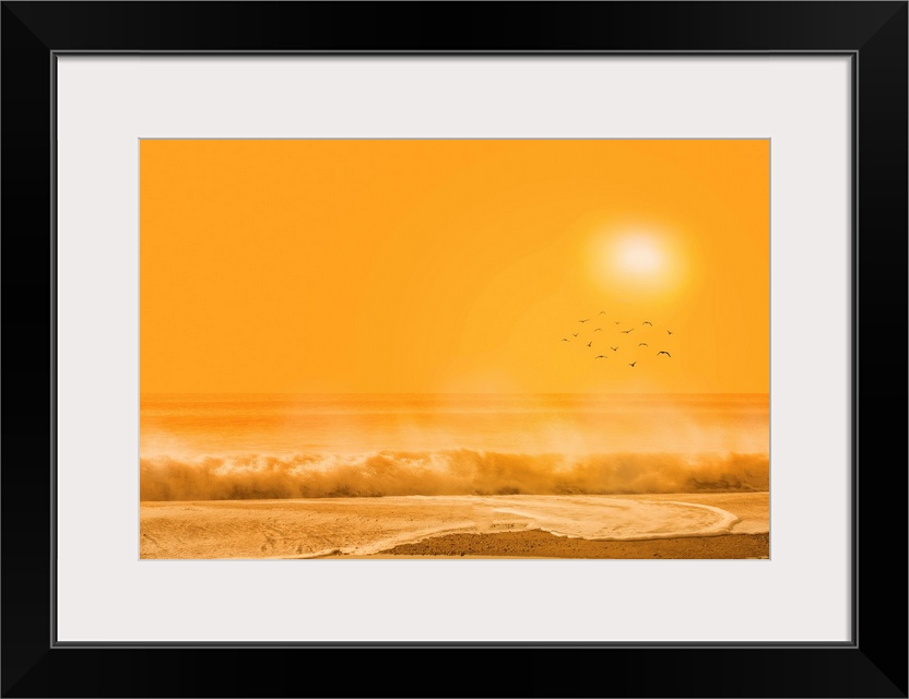 A photograph of a beach scene under an orange sky.