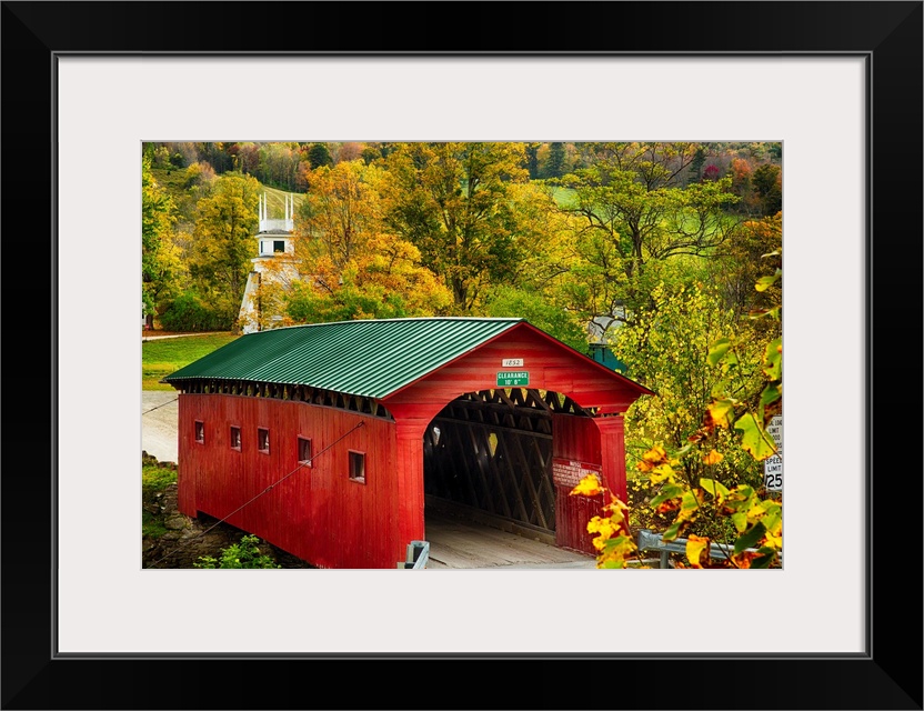 Fine art photo of a red covered bridge in Vermont in the fall.