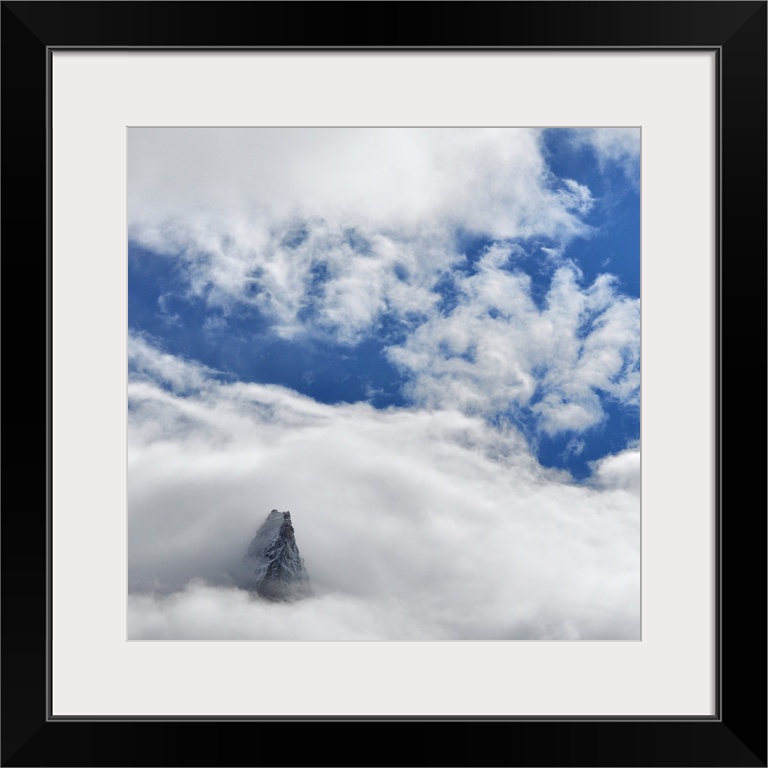 French mountain, Aiguille des Dru, crossing the blue sky in the valley of Chamonix in French Alpes.