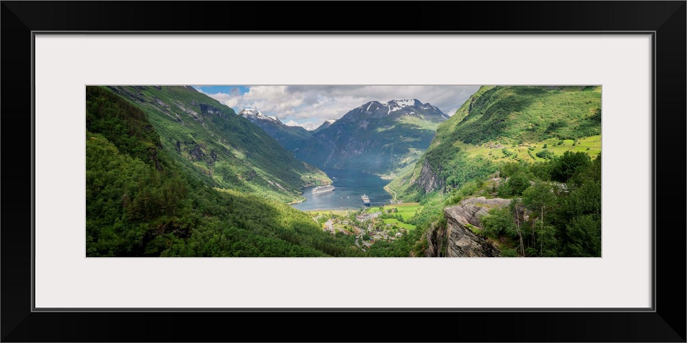 Panoramic photograph of a stunning mountain valley scene.