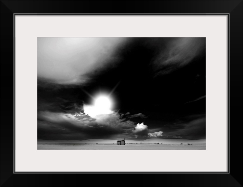 Black and white landscape with a threatening sky