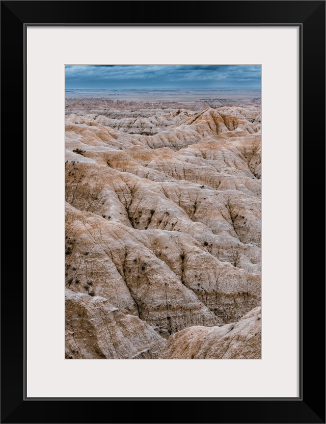 Striking geologic deposits and layered rock formation in Badlands National Park South Dakota.