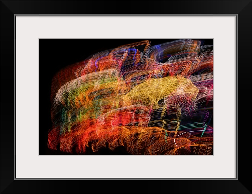 Abstract image created by a long exposure of moving lights.