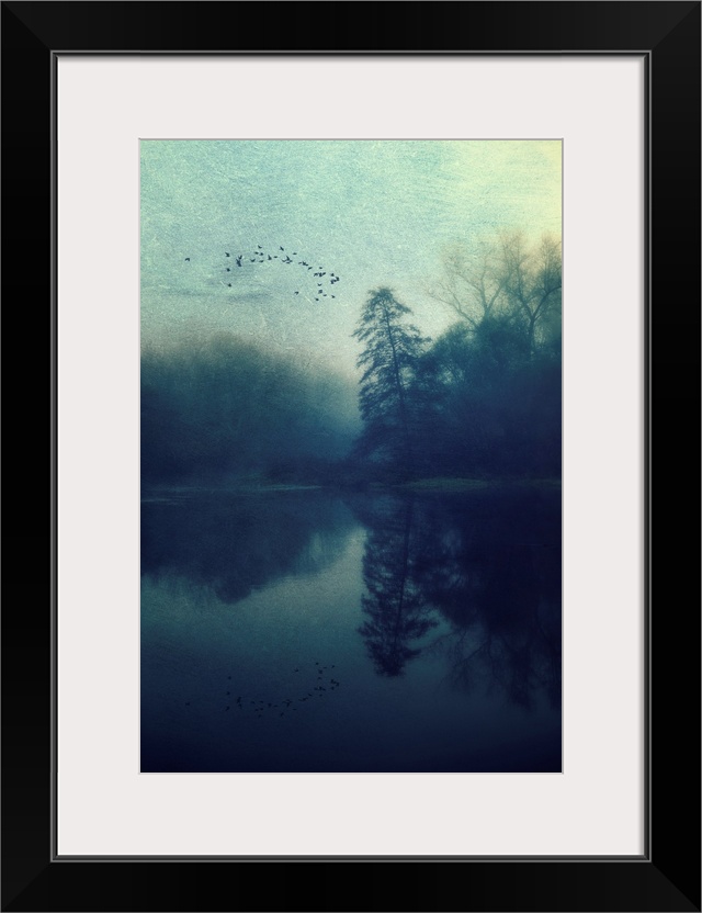 Blue landscape at sunrise around a lake