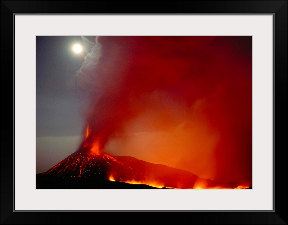 Fine art photo of a volcano erupting and spewing ash into the night sky.