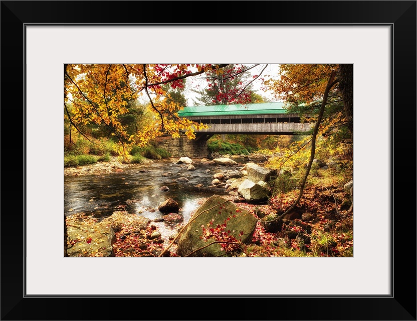 Fine art photo of a covered bridge in New England over Ellis River in autumn.