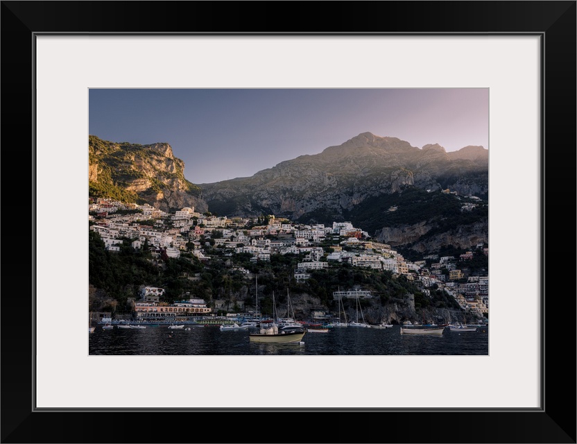 First beam of sunlight over Positano, one of Italy's most picturesque towns in Amalfi Coast.