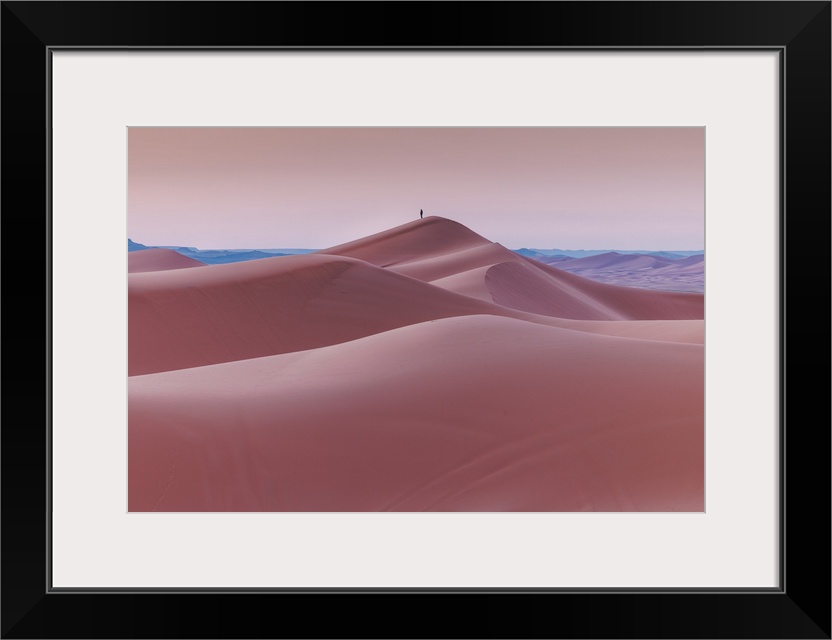 Peaceful moment in layers of sand dunes at Sahara Desert in Morocco before sunrise.