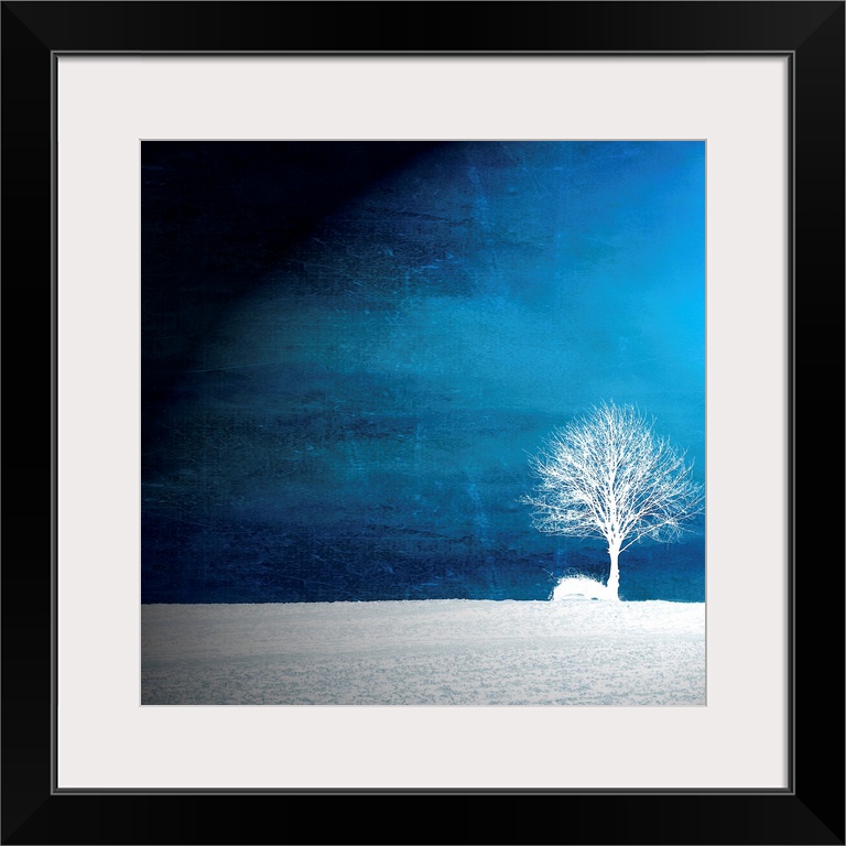 This oversize piece shows a single tree in white sitting in a bare field with a vibrant blue sky surrounding it.