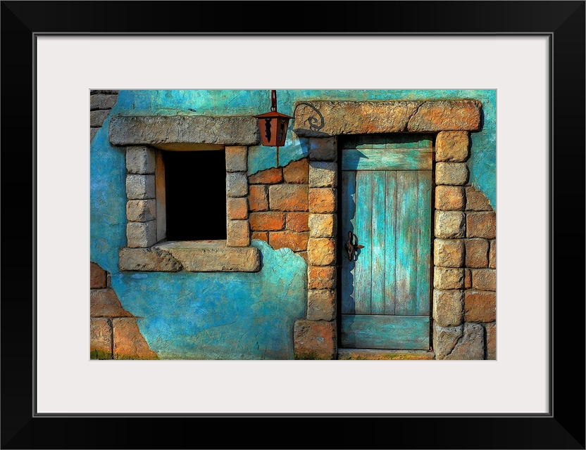 Landscape fine art photograph highlighting a door surrounded by a stone wall and window.