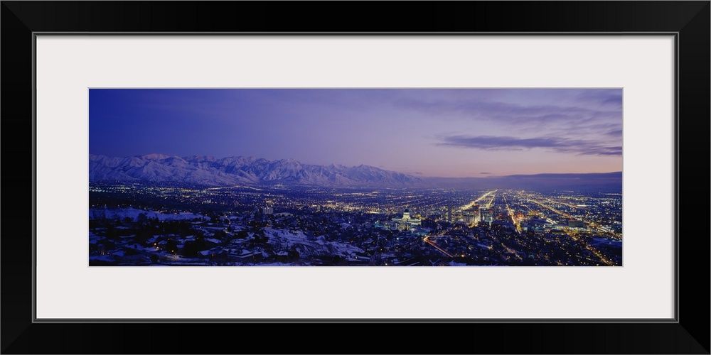 Aerial panorama of Salt Lake City lights at dusk.