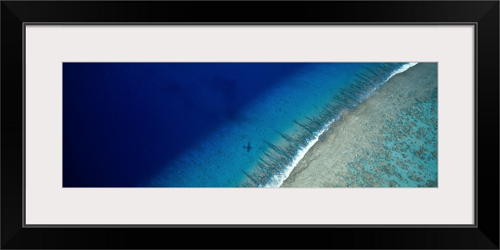 Large panoramic wall hanging photograph depicting an aerial view of a sand beach on Teti'aroa Island, Polynesia. The photo...