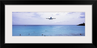 Airplane flying over the sea, Maho Beach, Sint Maarten, Netherlands Antilles