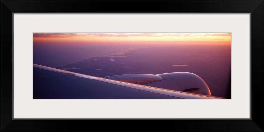 Airplane wing at dusk