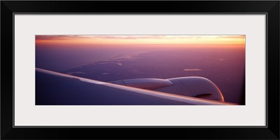 Airplane wing at dusk