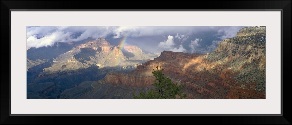 This is an aerial panoramic photograph of the rock formations and cliff walls of the enormous canyon.