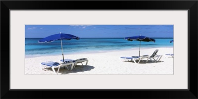 Beach chairs with beach umbrellas on the beach, Shoal Bay Beach, Anguilla
