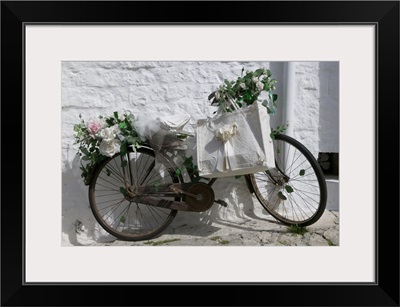 Bicycle parked against a wall, Trulli House, Alberobello, Apulia, Italy
