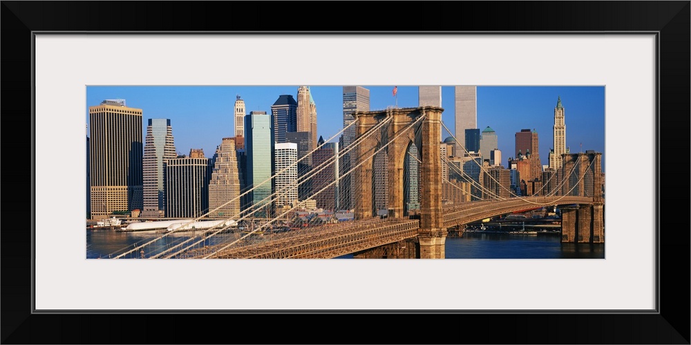 Panoramic photograph of overpass with skyline in the background under a clear sky.