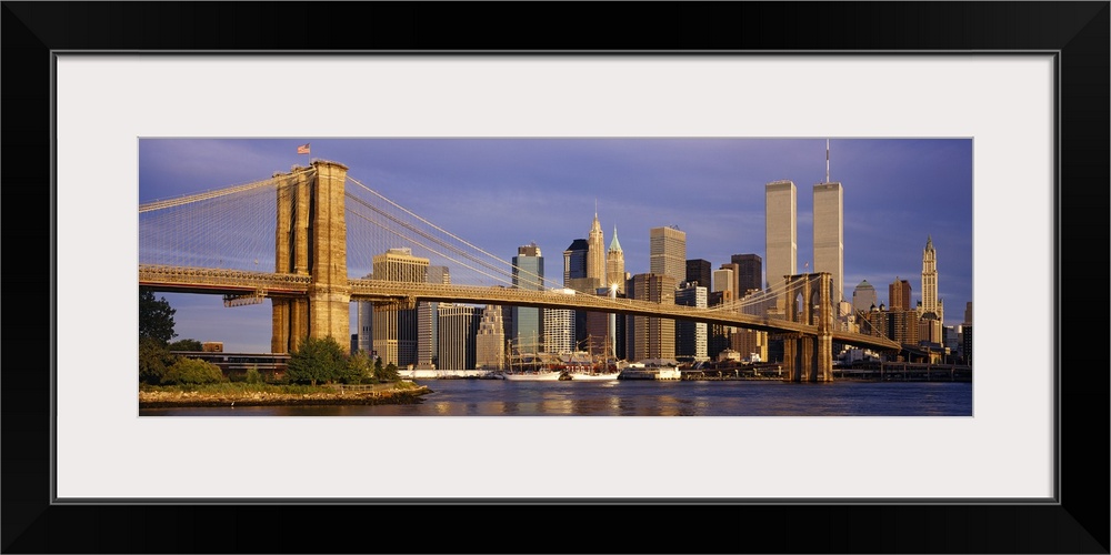 Panoramic, giant photograph of the Brooklyn Bridge in the sunlight, the New York City skyline in the background, including...